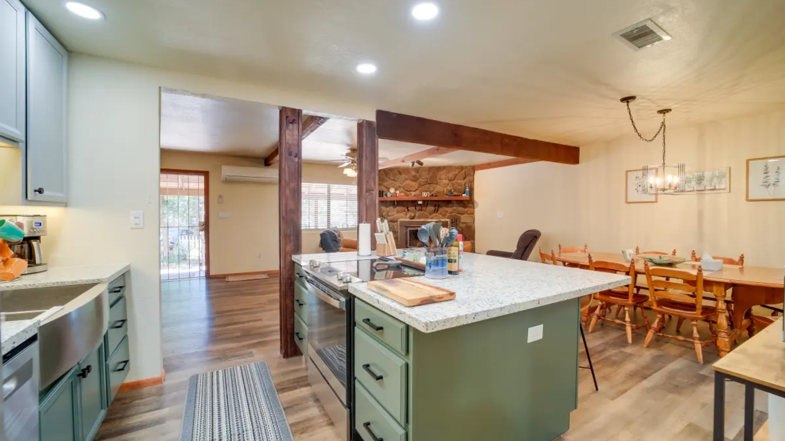 Kitchen and dining area with island seating and open flow.