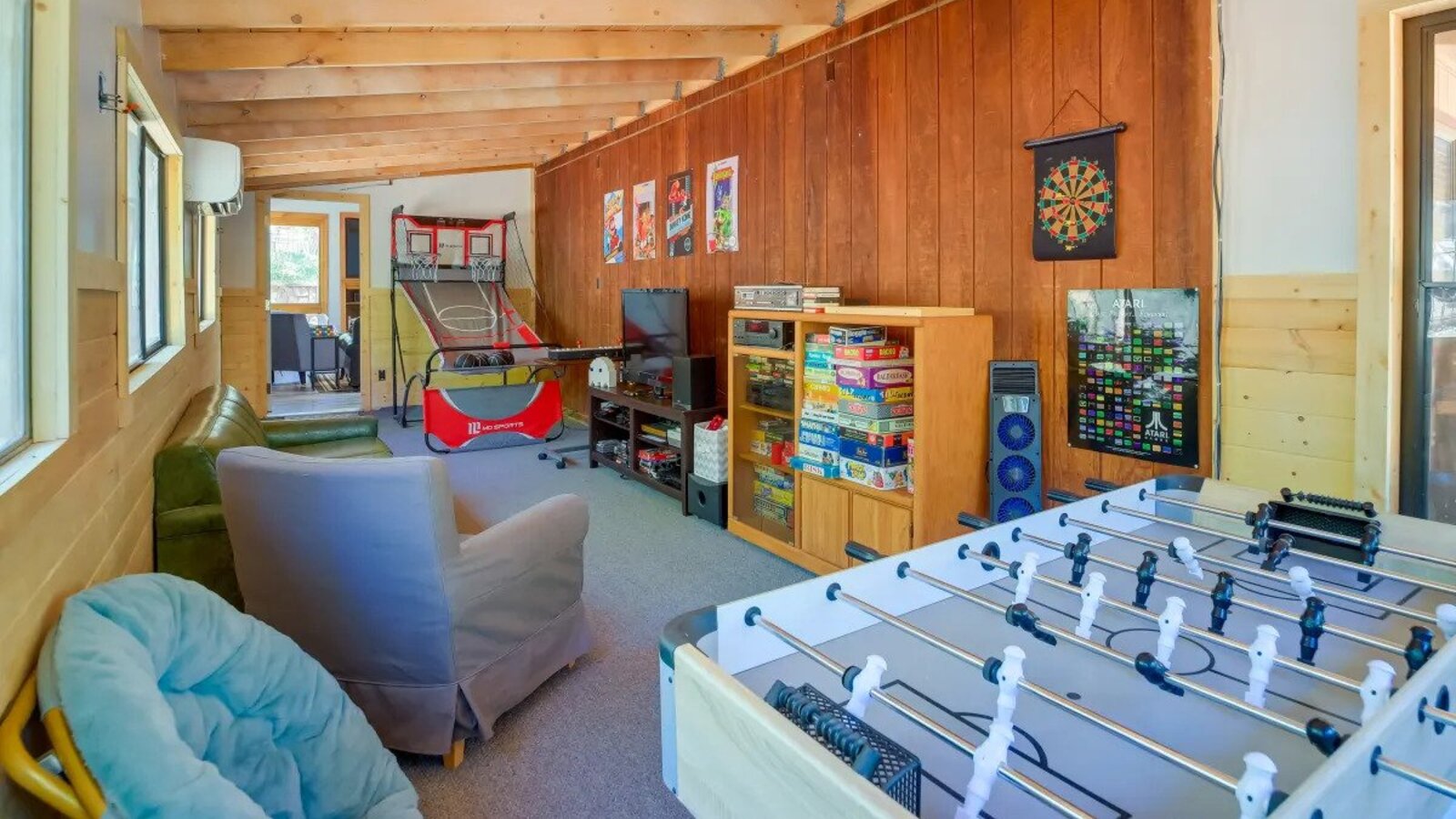 Retro game room with arcade machines and foosball.