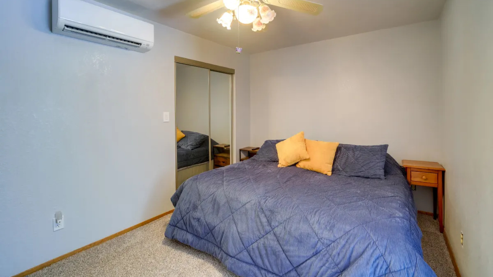 Bedroom with wood accent wall.